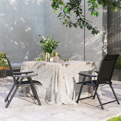 Pair of black folding outdoor chairs arranged around a table