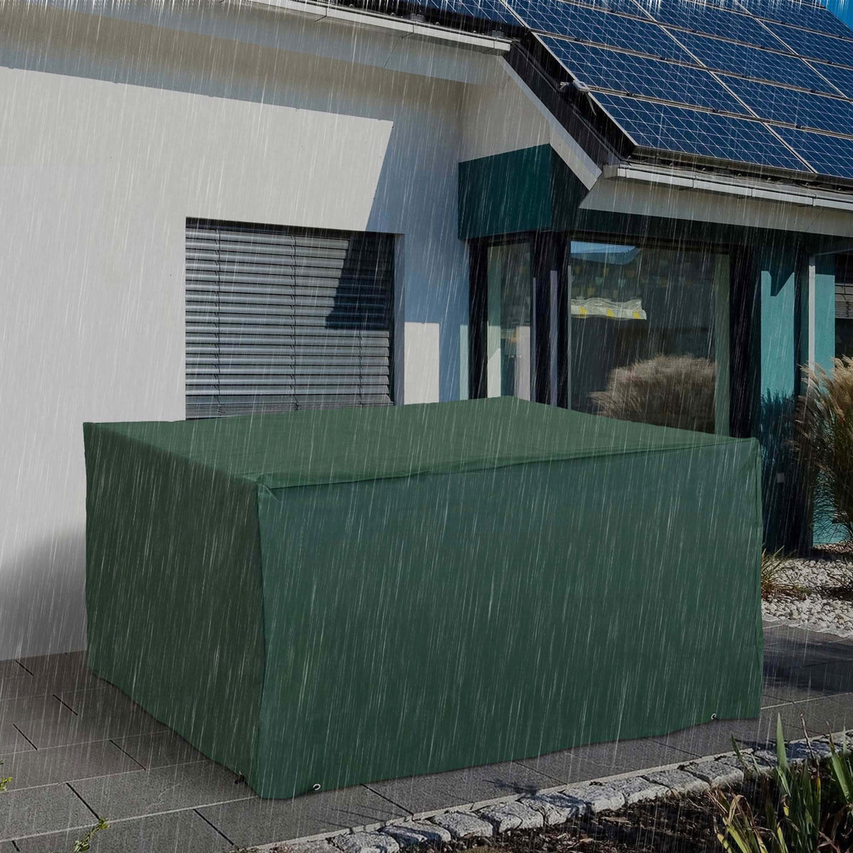 Outsunny green furniture cover protecting a patio table set from rain