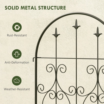 Close-up of arched metal trellis scrollwork and pointed finials