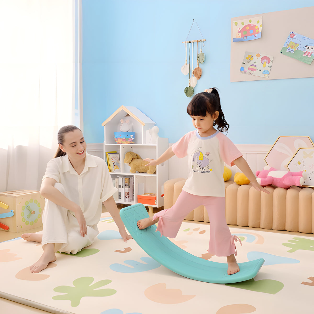 Curved blue balance board used by a child for balancing