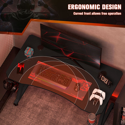 Black gaming desk with curved front edge for ergonomic use