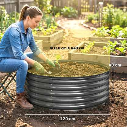 Dark grey round raised planter bed, 120 cm wide and 43 cm high, filled with soil