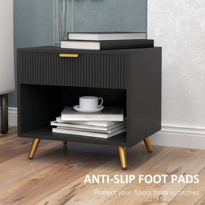 Black bedside table with fluted drawer, open shelf, gold-tone legs, and anti-slip foot pads