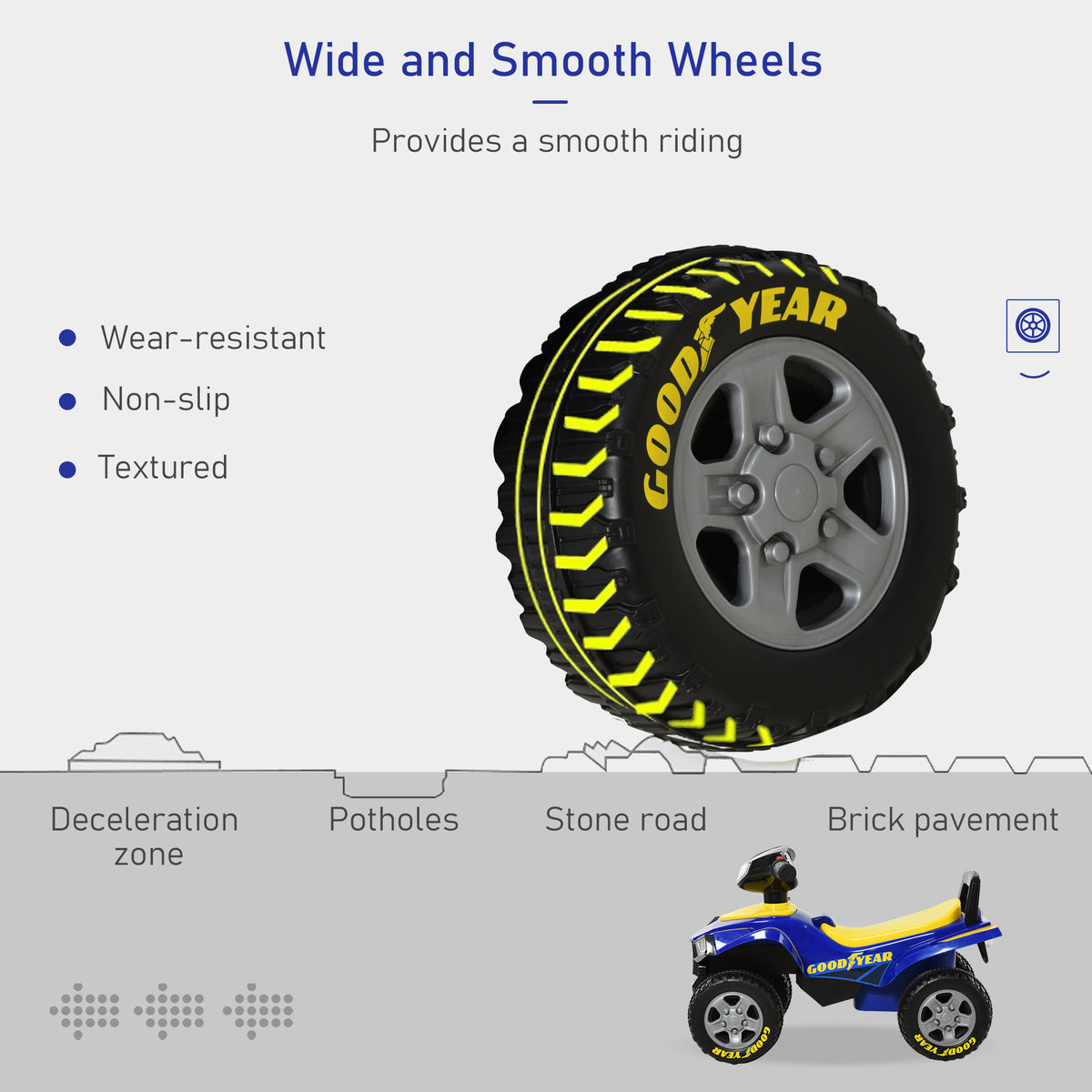 Close-up of the quad's wide black tire with yellow Goodyear lettering and gray hub
