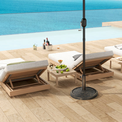 Round bronze-tone parasol base supporting an umbrella beside poolside loungers
