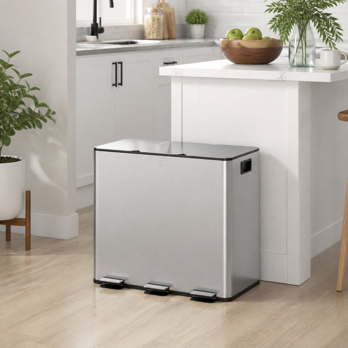 Silver HOMCOM triple pedal bin positioned beside a kitchen island