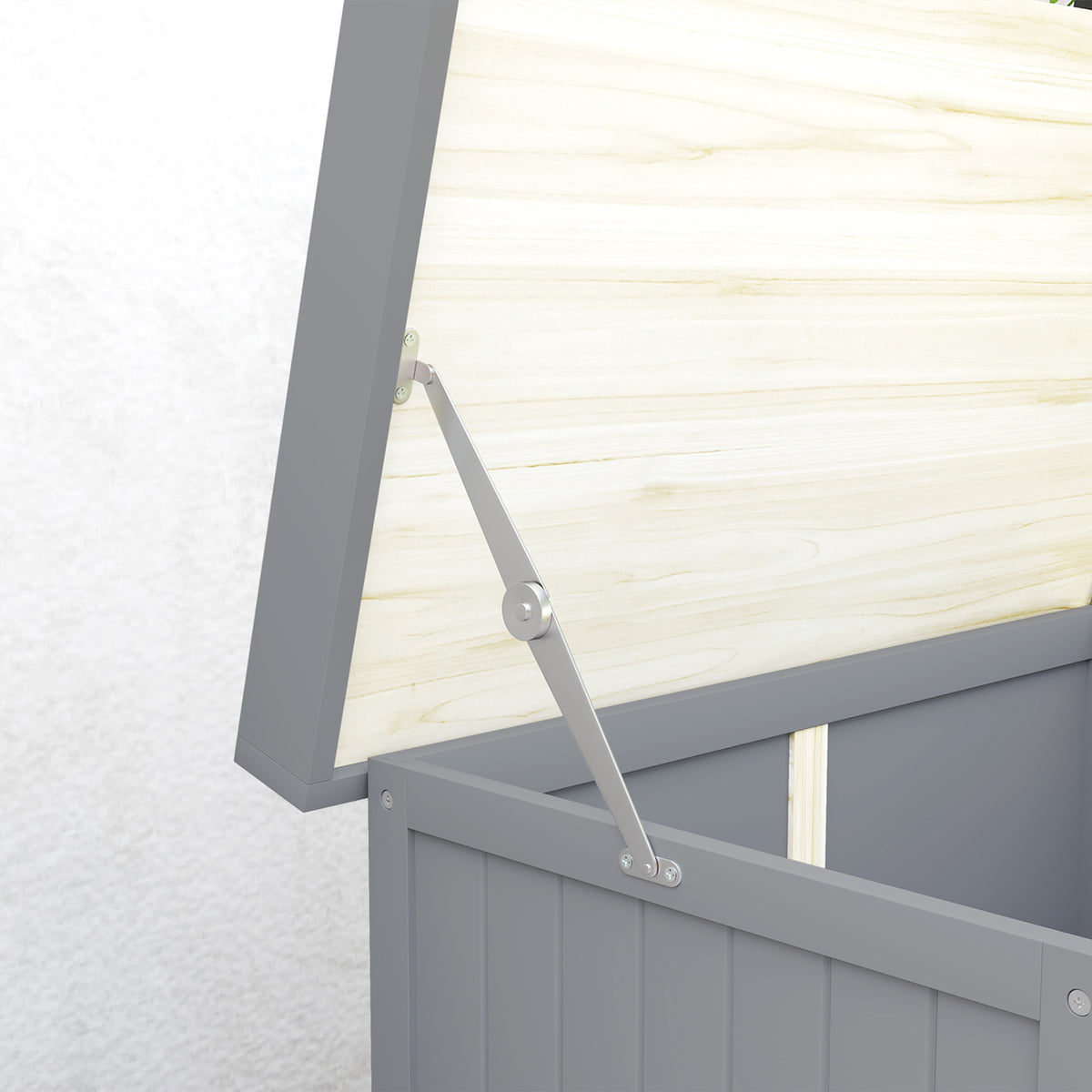 Close-up of the grey garden shed's raised roof support hinge and wooden roof underside