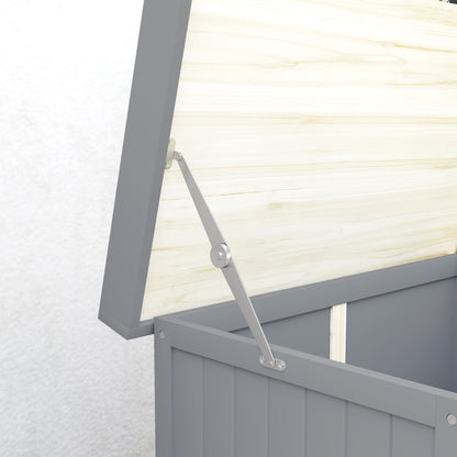 Close-up of the grey garden shed's raised roof support hinge and wooden roof underside