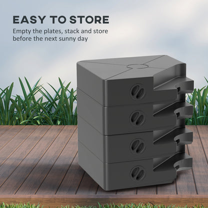 Outsunny black umbrella weight plates stacked for storage