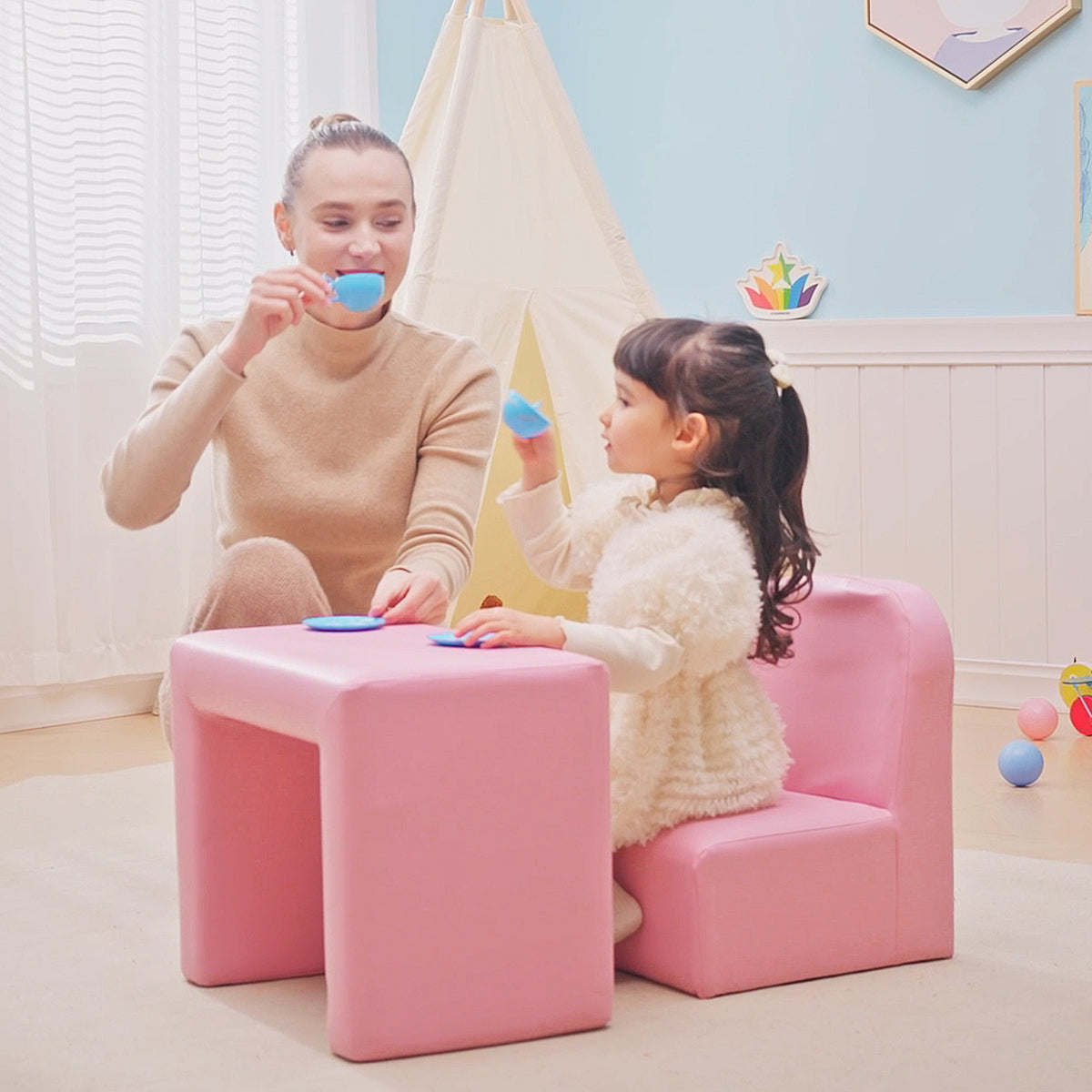 Pink toddler sofa chair used with its matching table for play