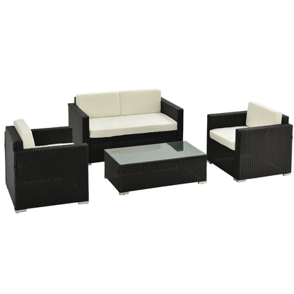Black rattan sofa set with cream cushions, two armchairs, a loveseat, and a glass-top table