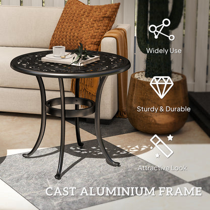 Black cast aluminum patio table with decorative round top and curved legs