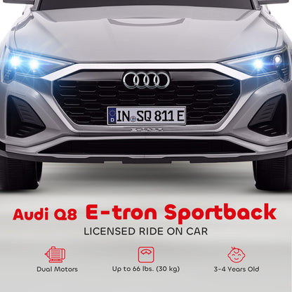 Front grille and illuminated headlights of the grey Audi Q8 e-tron Sportback ride-on car