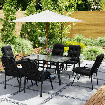 Black outdoor dining set with glass-top table and six cushioned chairs