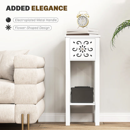 White floral cut-out side table with metal drawer pull and open lower shelf