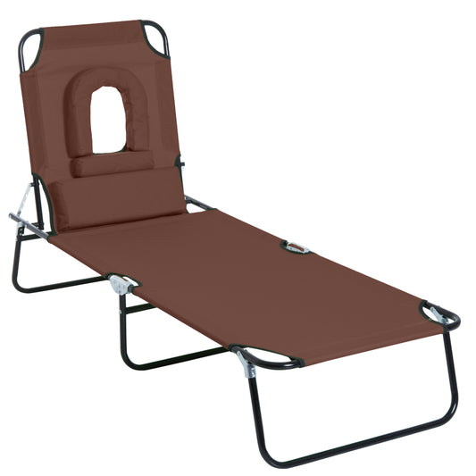 Photo of Outsunny Folding Sun Lounger with Face Hole, 4-Position Adjustable Backrest Garden Recliner Chair Sunbed, Outdoor Lounge Chair with 600 D Oxford Cloth Seat, Pillow for Beach, Brown in Brown colour on a white background