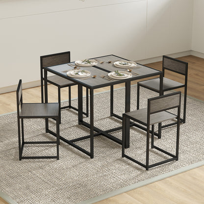 Gray wood-effect dining table with four matching black steel-frame chairs