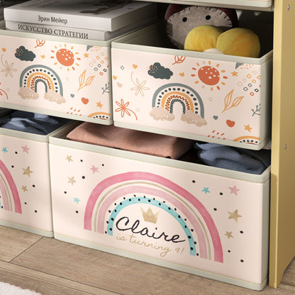 Close-up of AIYAPLAY fabric drawers with rainbow and sun prints in a yellow-frame unit