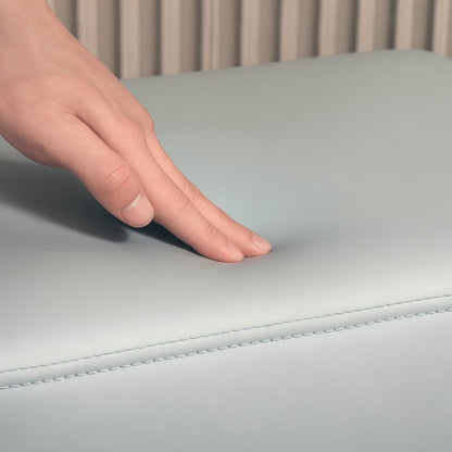 Grey PU leather footstool close-up showing its padded, stitched top