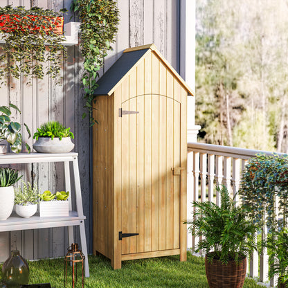 Natural wood garden storage shed with sloped roof and closed lockable door
