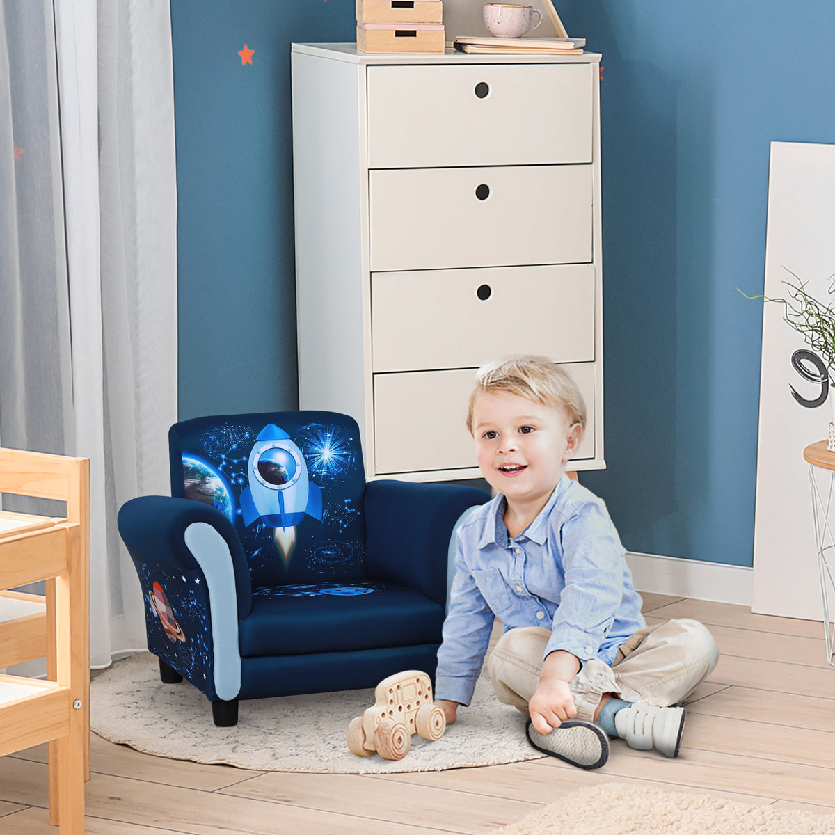 Blue space-print kids' armchair with rounded arms and short black feet