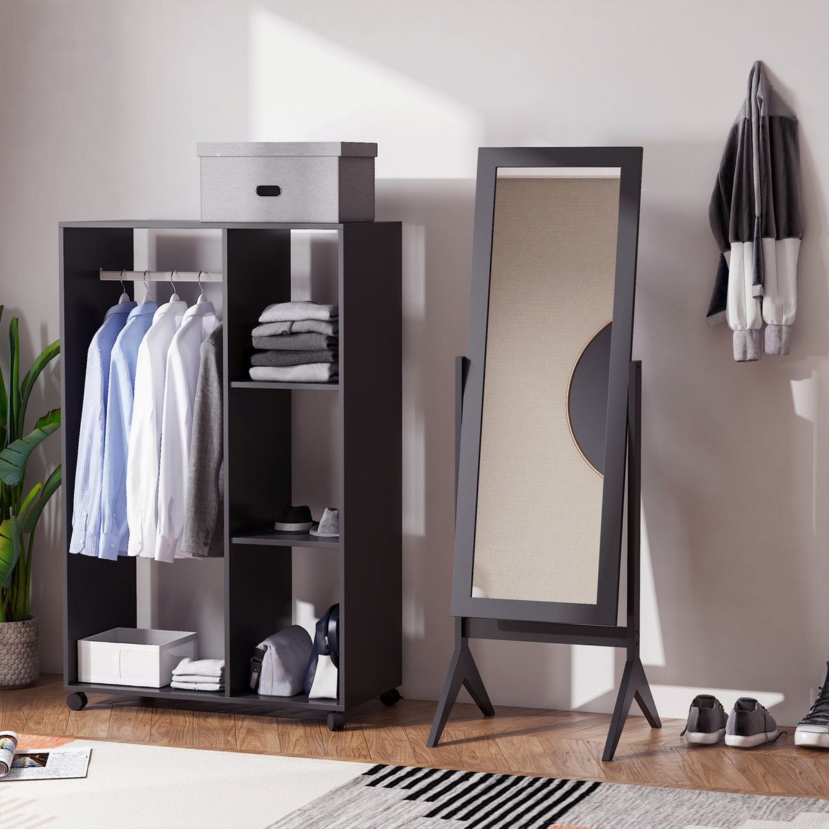 Brown freestanding full-length mirror beside a wardrobe, showing its angled stand