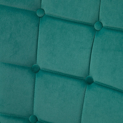 Dark green velvet armchair back with square button tufting and stitched panels