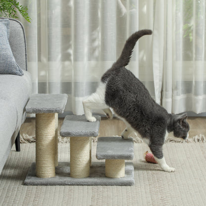 Gray plush pet stairs with sisal-wrapped posts, shown as a cat steps down.