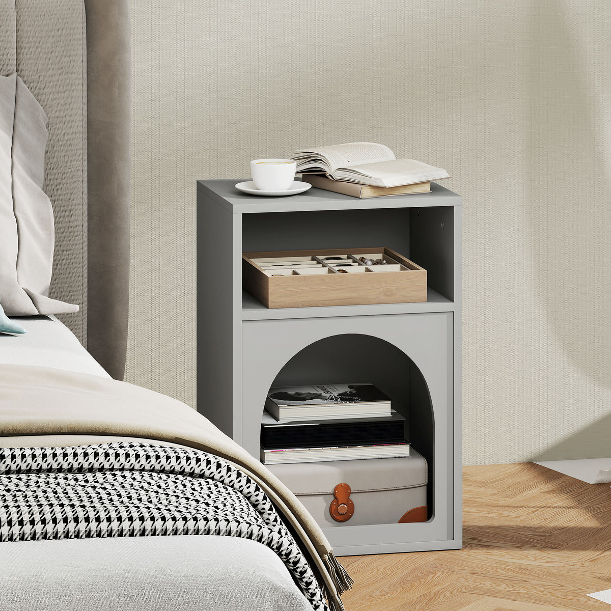 Grey bedside table with a shallow upper shelf and arched lower compartment