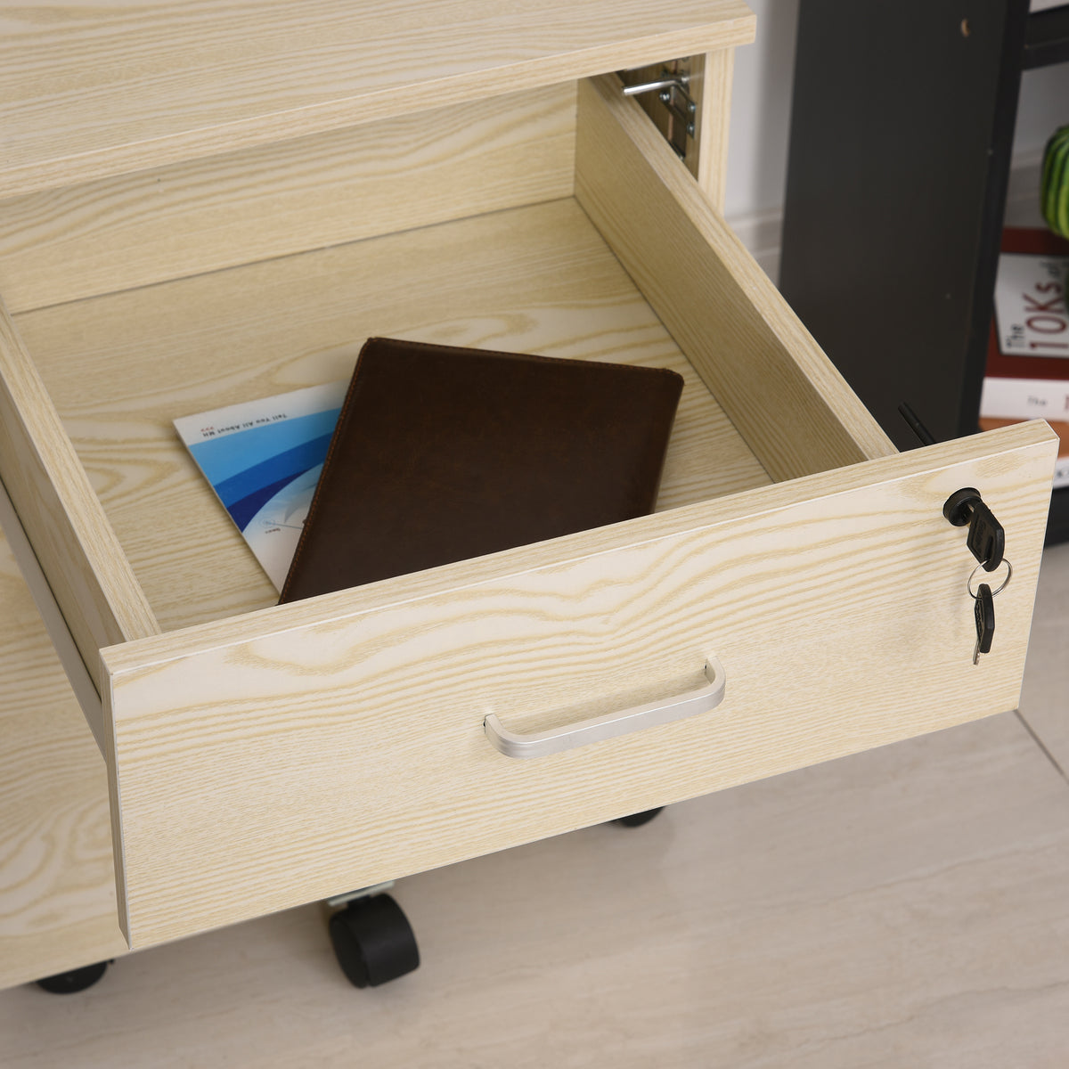 Open oak grain filing cabinet drawer with lock, handle, and documents inside